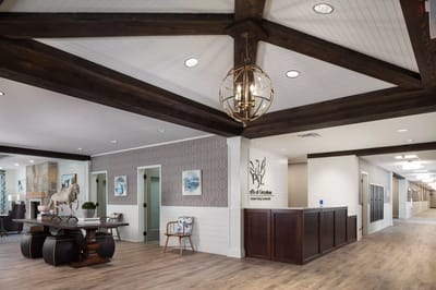 Interior view of a common area with wooden beams and seating