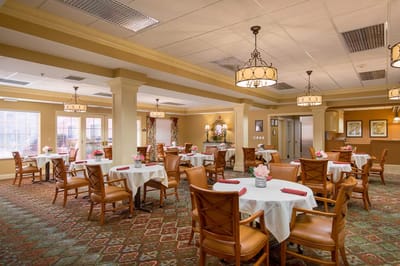 Bright dining room with tables set for meals
