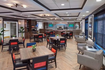 Bright dining area with tables and chairs