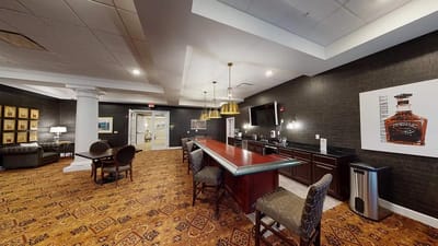 A well-designed common area with a bar and seating