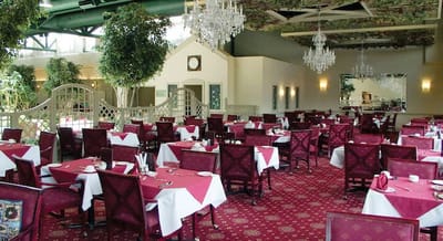 Dining room setup with tables and chairs