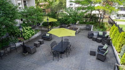 Outdoor patio area with seating and umbrellas