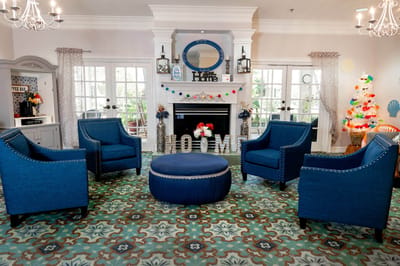 Bright common area with cozy seating and colorful decor