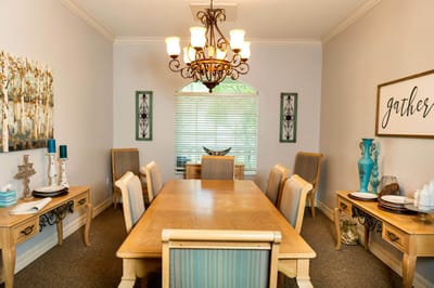 Bright dining room with wooden table and decorative accents