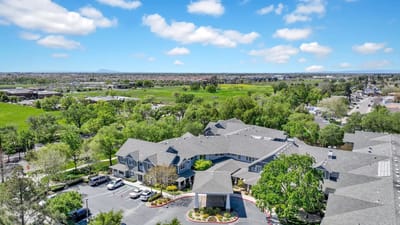Aerial view of The Commons at Elk Grove with surrounding greenery