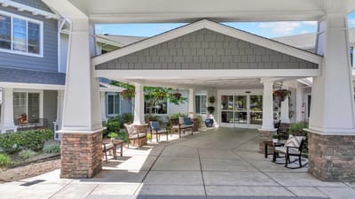 Entrance of a senior living facility with seating