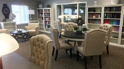Bright common area with bookshelves and seating