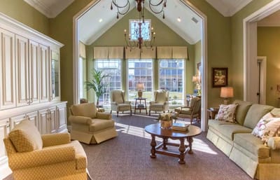 Bright common area with comfortable seating and large windows