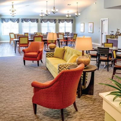 Bright common area with seating and tables