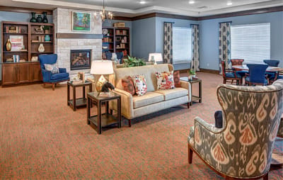 Interior common area with seating and bookshelf
