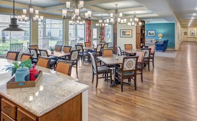Bright dining area with wooden furniture and ample natural light