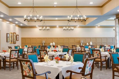 Dining room with tables set for residents