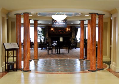 Bright interior lobby with piano and comfortable seating