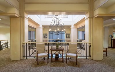 Bright interior space with chairs and chandelier