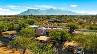 Aerial view of facility with mountain backdrop
