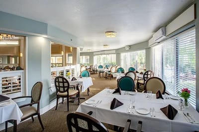 Elegant dining room setup with tables and chairs