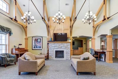 Spacious common area with seating and a fireplace