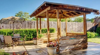 Outdoor gazebo with seating and garden area