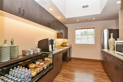 Bright kitchen area with coffee and snacks