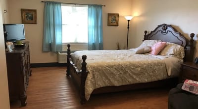 Cozy resident room with a bed and furniture