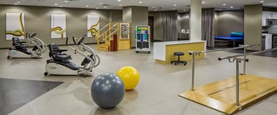 Interior view of a therapy gym with equipment