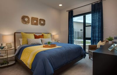 Brightly decorated resident room with large window