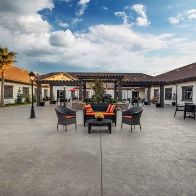 Outdoor seating area with comfortable furniture and landscaping