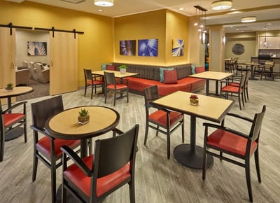 Interior seating area with tables and chairs in a warm atmosphere