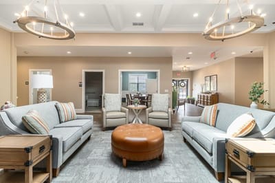 Common area with seating and decor in a senior living facility