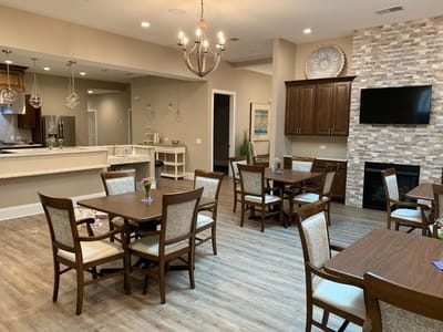 Bright common area with tables and chairs