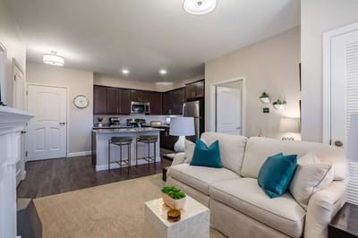 Modern kitchen and living area in a senior living apartment
