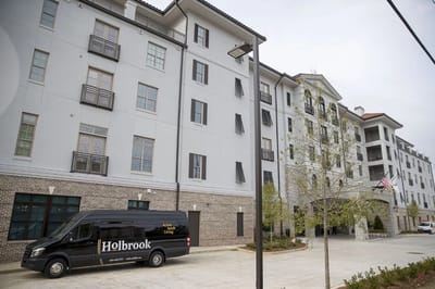 Exterior view of The Holbrook Decatur with facility van