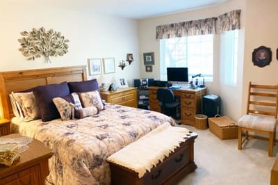 Cozy private resident room with a bed and desk