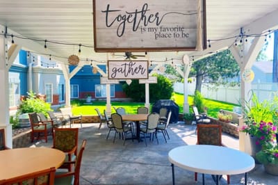 Outdoor patio area with tables and chairs