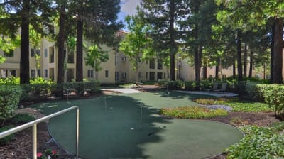 Well-maintained outdoor space with greenery and seating