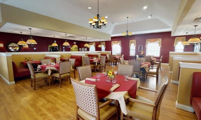 Dining room with tables set for a meal