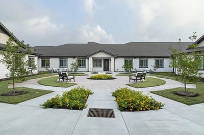 Outdoor courtyard with seating and landscaped gardens