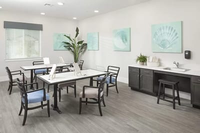 Bright common area with tables and chairs