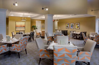 Dining area with tables set for residents