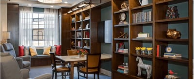 Cozy common area with bookshelves and seating