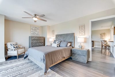 Modern bedroom interior with gray decor and lighting