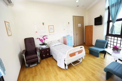 Private resident room with a bed and seating area