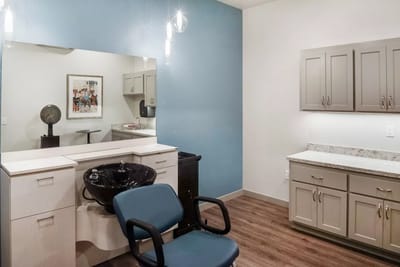 Interior view of a hair salon with styling chair