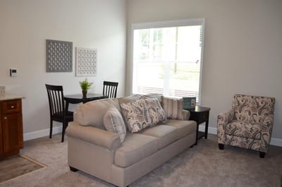 Cozy living area with a sofa and dining table