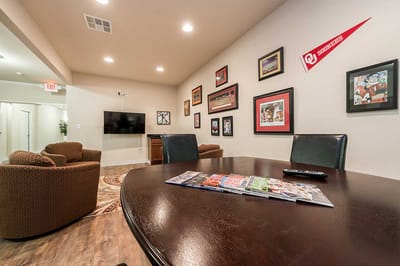 Common area with seating and sports memorabilia on the walls