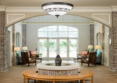 Bright lobby area with comfortable seating and fountain