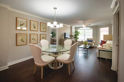 Bright activity room with a dining table and decorative wall art