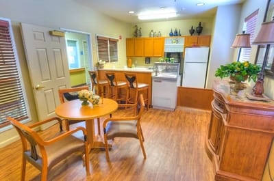 Bright common area with seating and kitchenette