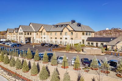 Exterior view of The Moments Memory Care Lakeville with landscaped area