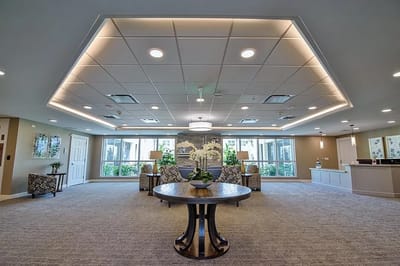 Bright common area with comfortable seating and plants